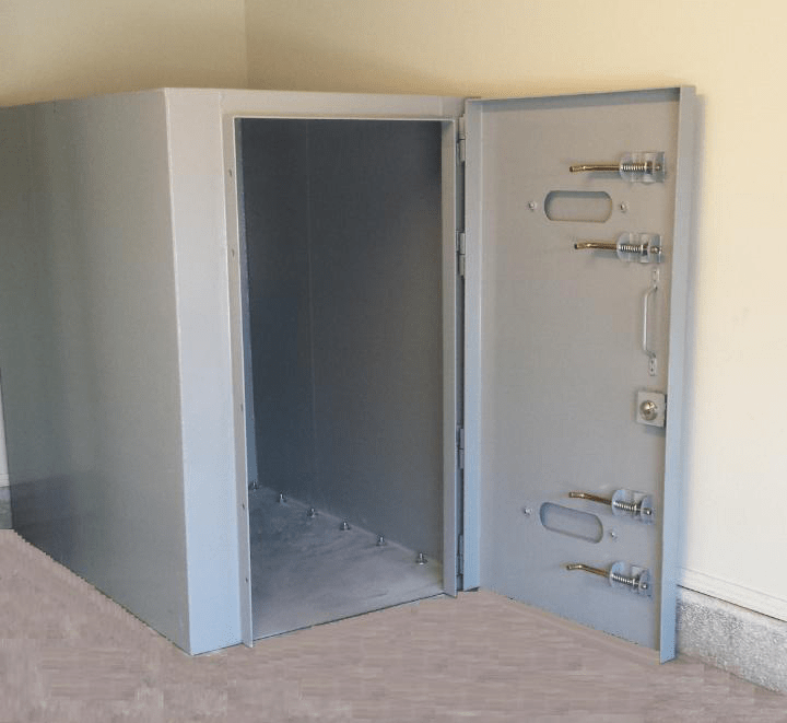A high-strength steel safe room, prefabricated for easy assembly, awaits installation within an Oklahoma home
